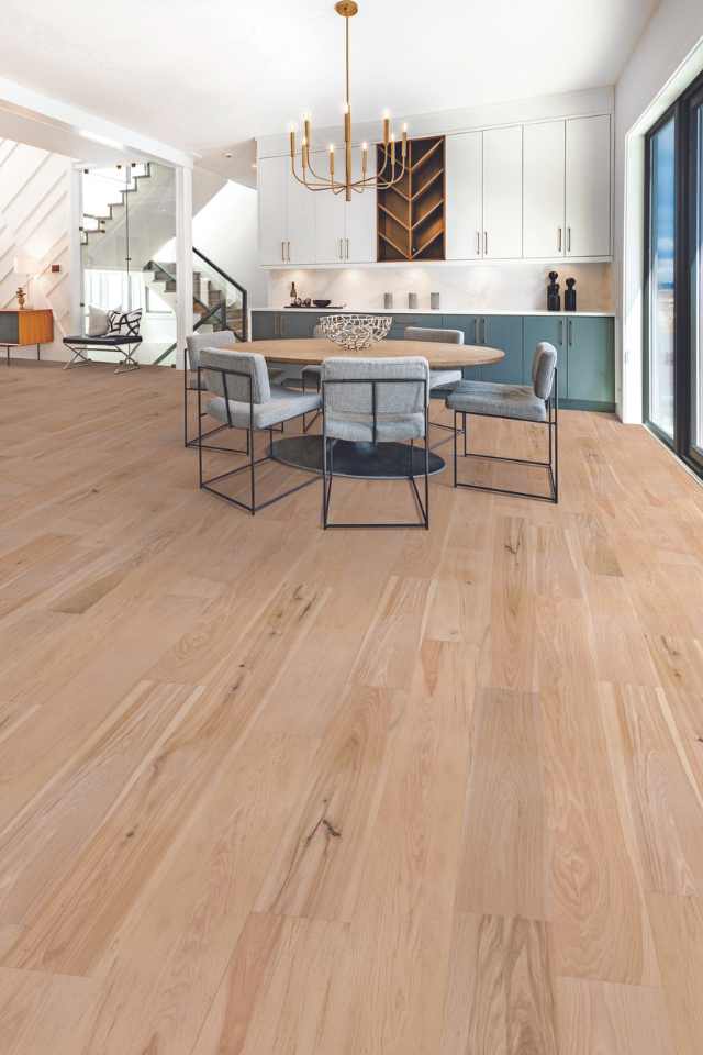 hickory hardwood in dining room with wet bar and modern light installation